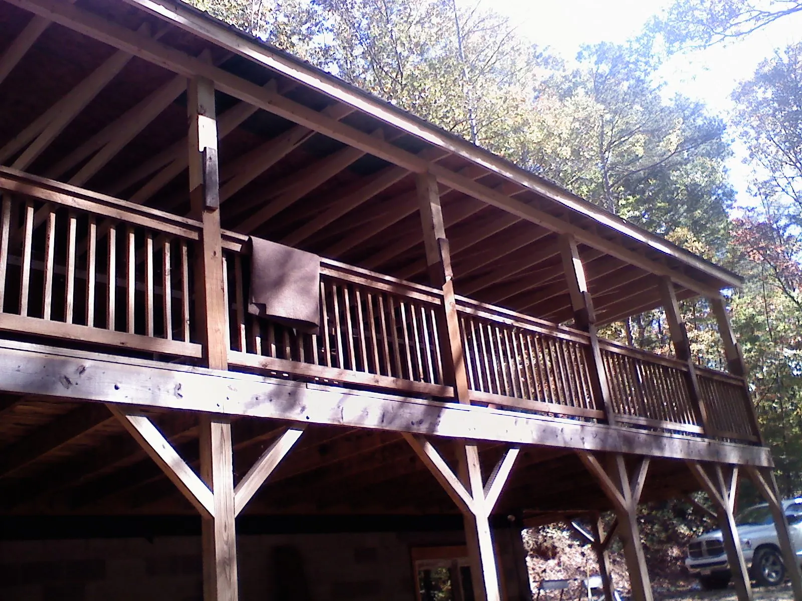 Timber framing under a new elevated porch and deck — Roof Leak Repair in Big Sky by Roofing Brothers